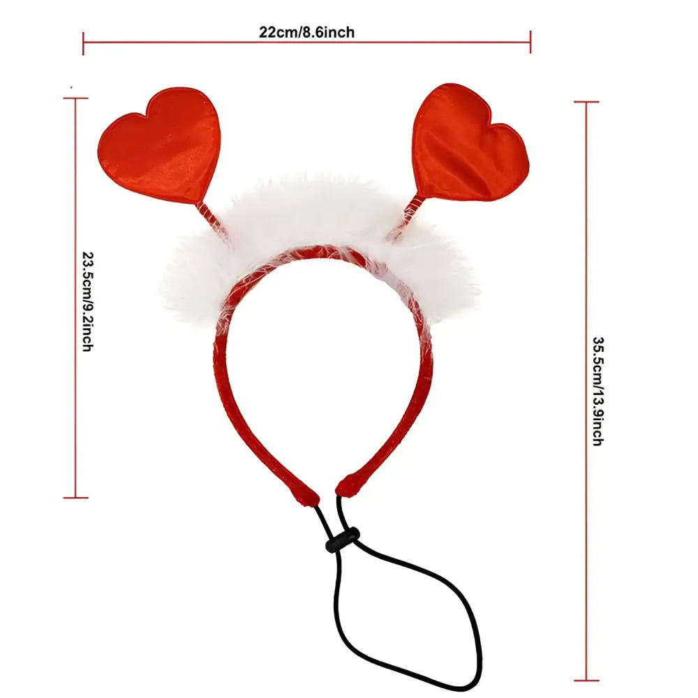 A dachshund wearing a valentine’s day pet scarf in red and pink sheer organza with heart embellishments for dog party decorations