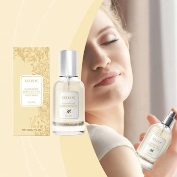 A sleek transparent vanilla body hair perfume spray bottle with silver nozzle containing light-colored liquid