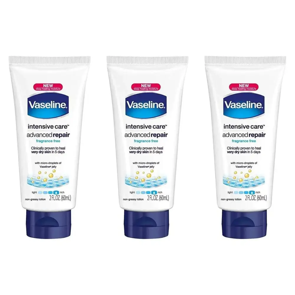 Three white tubes of vaseline intensive rescue repairing moisture lotion with dark blue caps healing dry skin