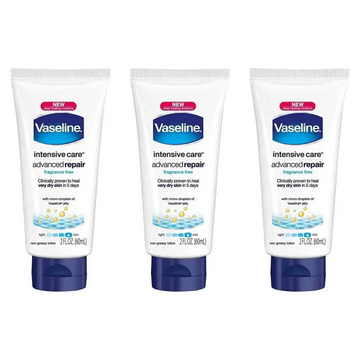 Three white tubes of vaseline intensive rescue repairing moisture lotion with dark blue caps healing dry skin