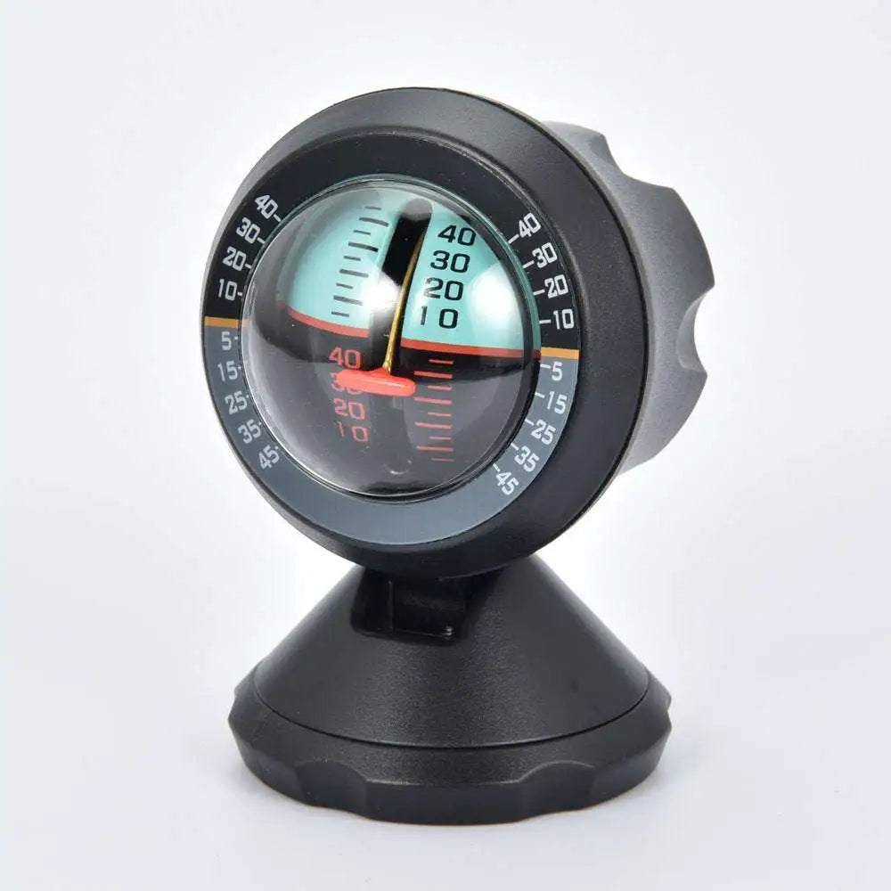 Black plastic vehicle mounted sensing slope meter with circular dial, red needle, and orange precise angle measurement markings