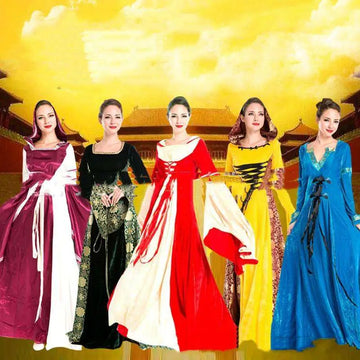 Five women wearing elaborate velvet halloween cos ball queen dresses in contrasting colors with intricate detailing