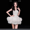 White velvet strapless dress with fitted bodice and flower pettiskirt french ruffles in layered tulle skirt