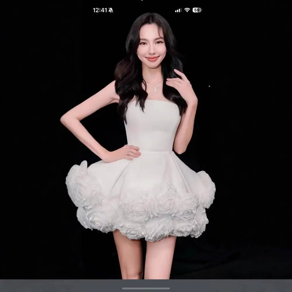 White velvet strapless dress with fitted bodice and flower pettiskirt french ruffles in layered tulle skirt
