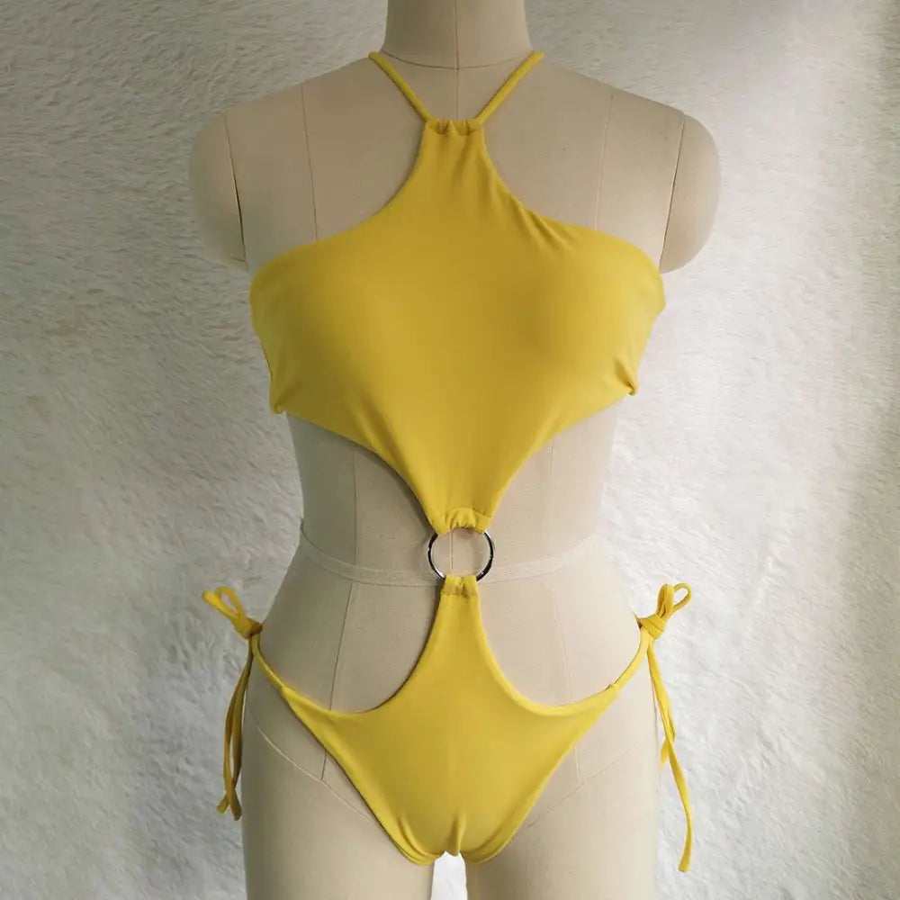 A vibrant yellow one-piece swimsuit with halter neckline and cutout back featuring a silver ring accent and side ties