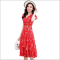 A vibrant red chiffon dress featuring delicate white leaf embroidery and a ruffled hem in a midi length dress image
