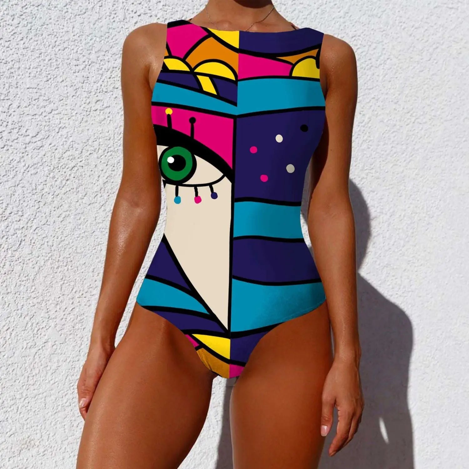 A vibrant sleeveless one-piece swimsuit with a bold pop-art design featuring a stylized green eye and geometric patterns in pink blue yellow and purple ideal for pairing with triangle bikini or high waist bikini sets in 2026.