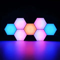 A modern set of vibrant smart hexagon lights with six interlocking LED panels featuring dynamic blue pink and orange colors
