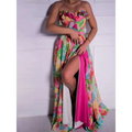 A vibrant strapless floral print maxi dress with a ruffled bodice in pink green yellow and blue hues