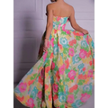 Vibrant strapless floral print maxi dress featuring a full skirt with pink teal and yellow floral patterns on light fabric