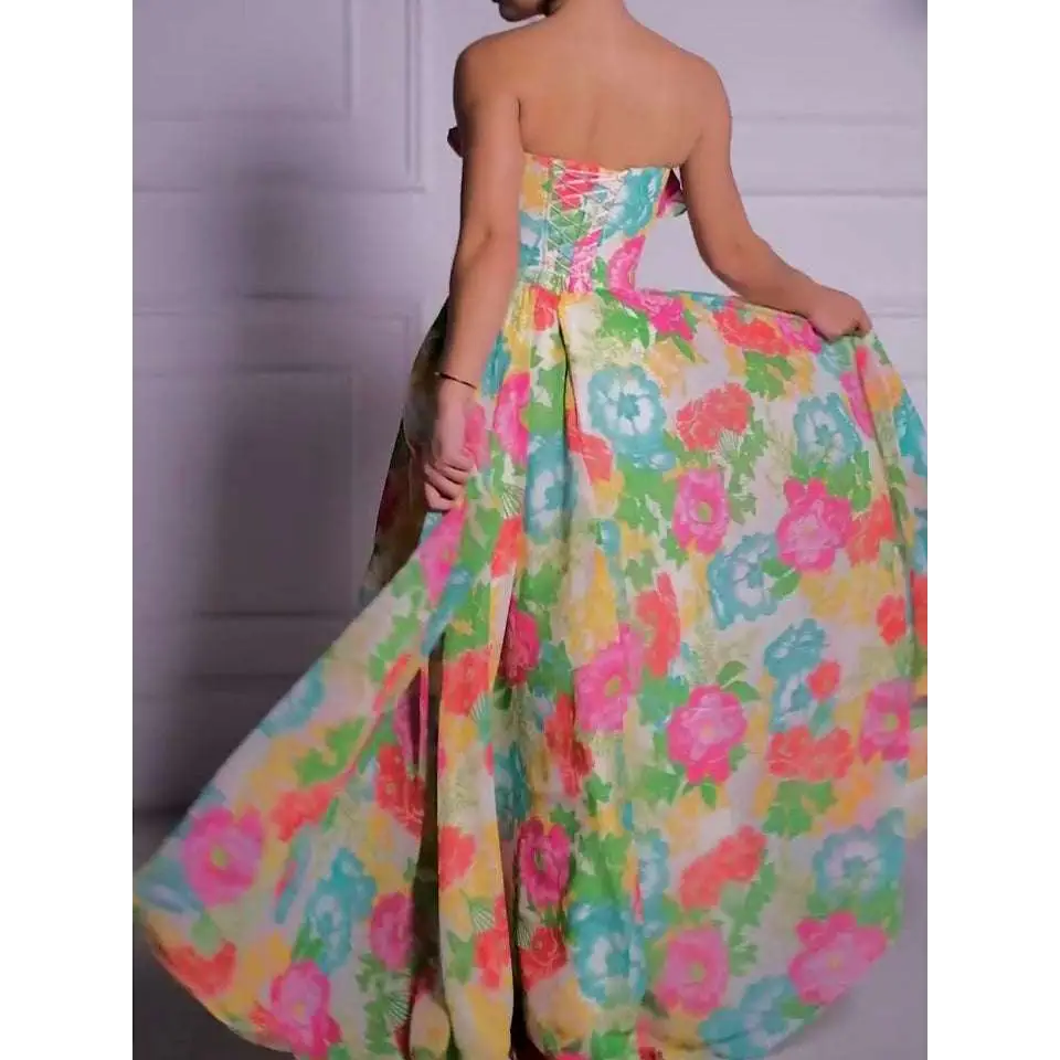 Vibrant strapless floral print maxi dress featuring a full skirt with pink teal and yellow floral patterns on light fabric