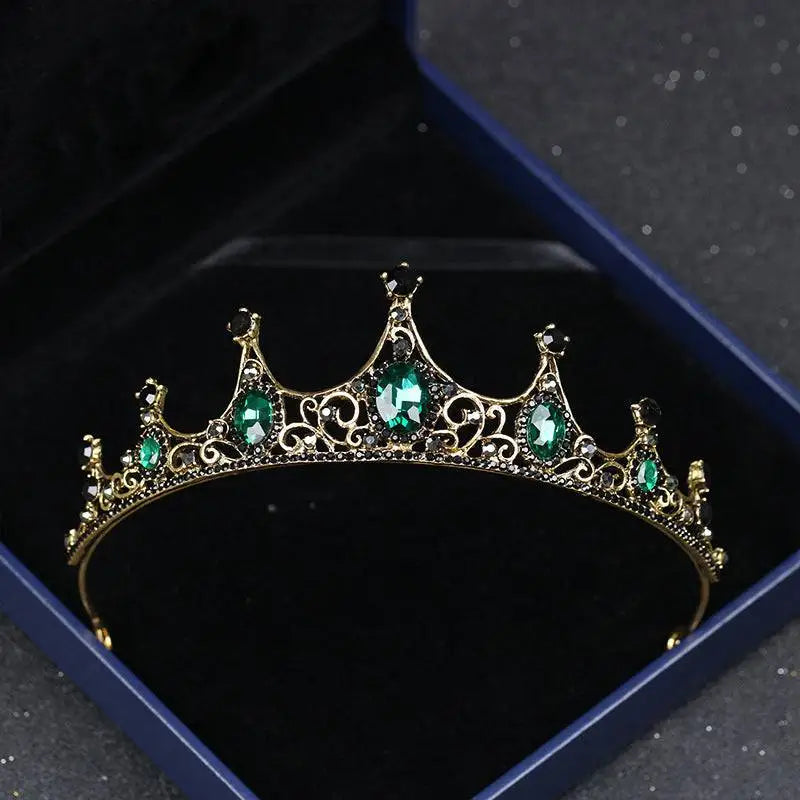 Vintage baroque alloy tiara with an ornate crown-like design featuring gold filigree and emerald green and black gemstones