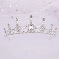 A vintage baroque alloy tiara with a sparkling silver finish, clear crystals, and ornate crown-like filigree detailing