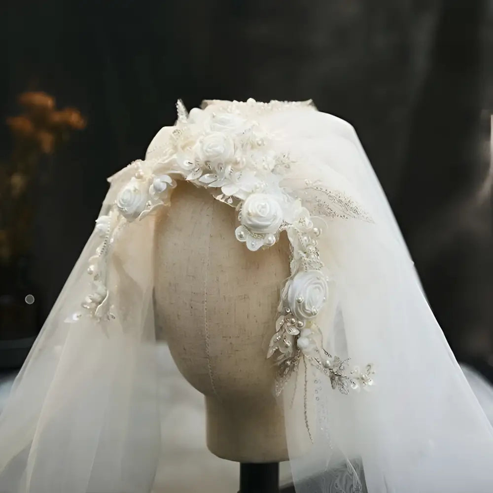 Elegant ivory white bridal veil featuring vintage beaded lace petal headdress with embroidered roses and sparkling beading