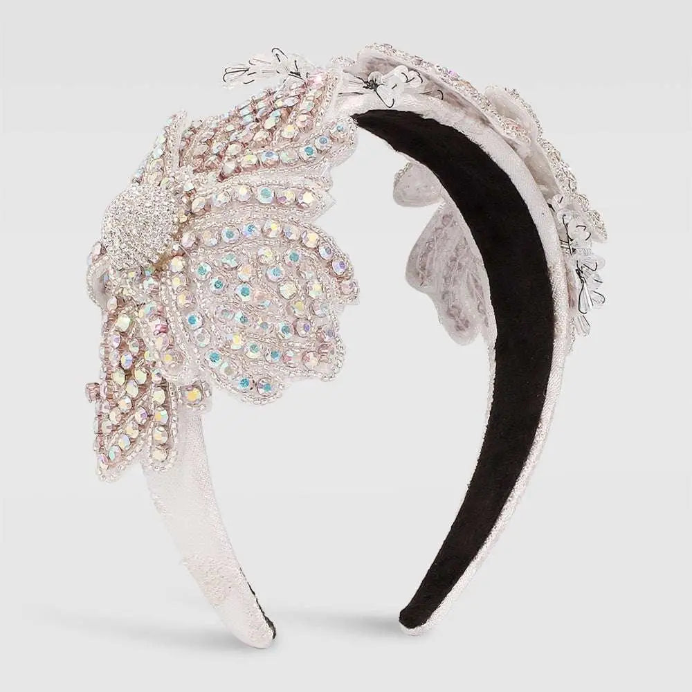A sparkling silver vintage crystal floral temperament hair accessory with intricate lace and iridescent gemstones