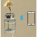 Vintage white gramophone with gold-toned horn and ornate detailing for classical living room tea stereo use