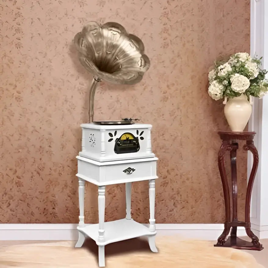 Vintage white gramophone with brass horn and ornate black cabinet detailing for classical living room stereo use