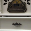 Antique-style silver-plated cd player with ornate detailing and digital display for vintage white gramophone classical living room