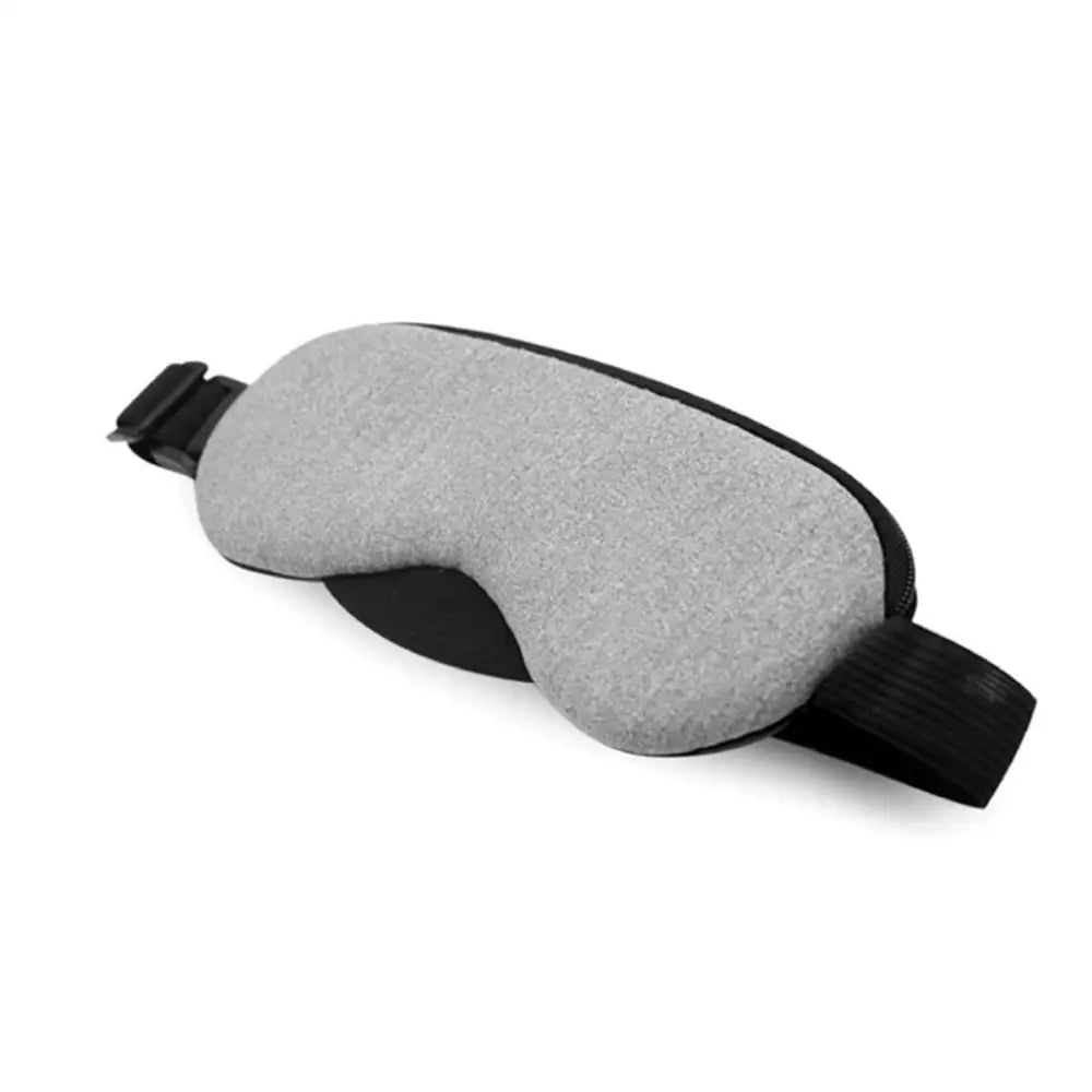Visionary smart eye massager mask in gray fabric with black adjustable straps and matching remote control for relaxation