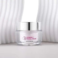 A clear glass jar with a silver lid containing white vitamin c brightening face cream by Royale Essence Lux 30g