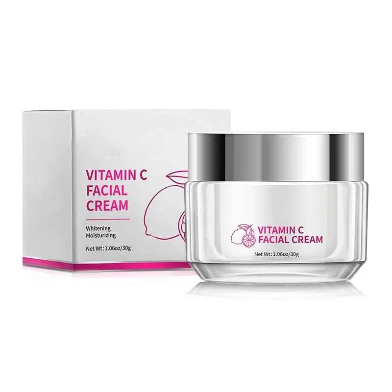 A sleek silver jar of royale essence lux vitamin c brightening face cream with a transparent body and orange slice label