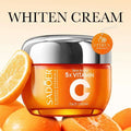 Sadoer vitamin c whitening face cream in a translucent orange jar with silver lid in an orange rectangular box whitening skin care