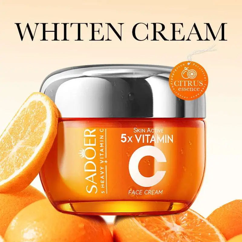 Sadoer vitamin c whitening face cream in a translucent orange jar with silver lid in an orange rectangular box whitening skin care