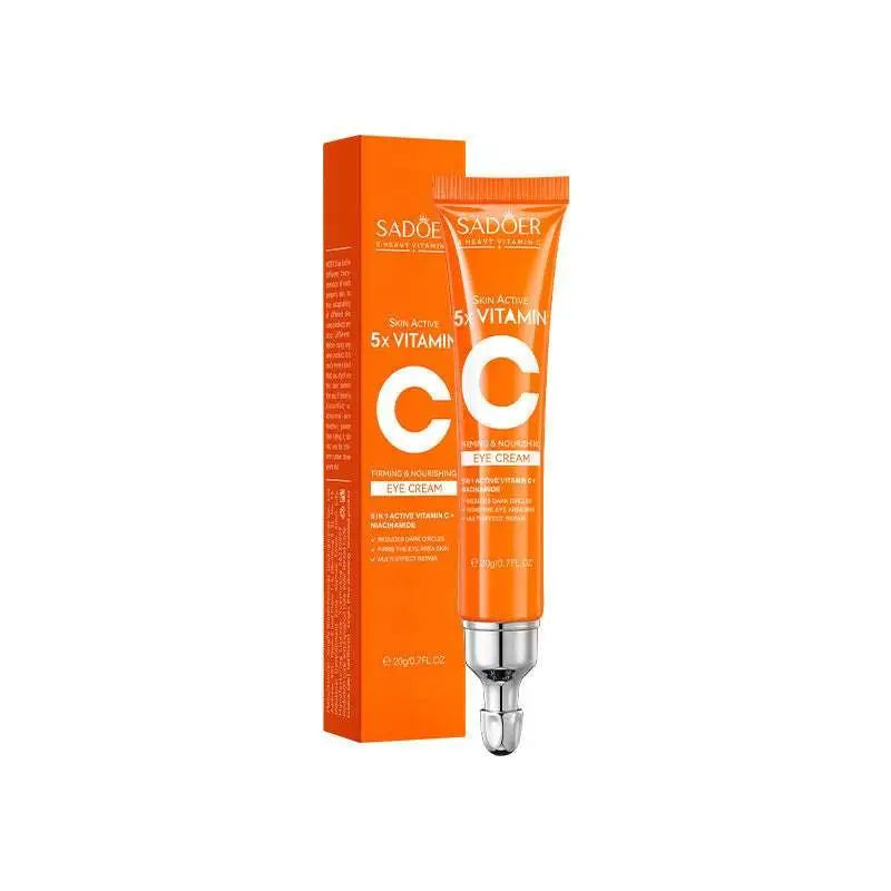 Orange tube of sadoer skin active 5x vitamin c firming eye cream with silver cap beside orange rectangular box for whitening skin care gift box