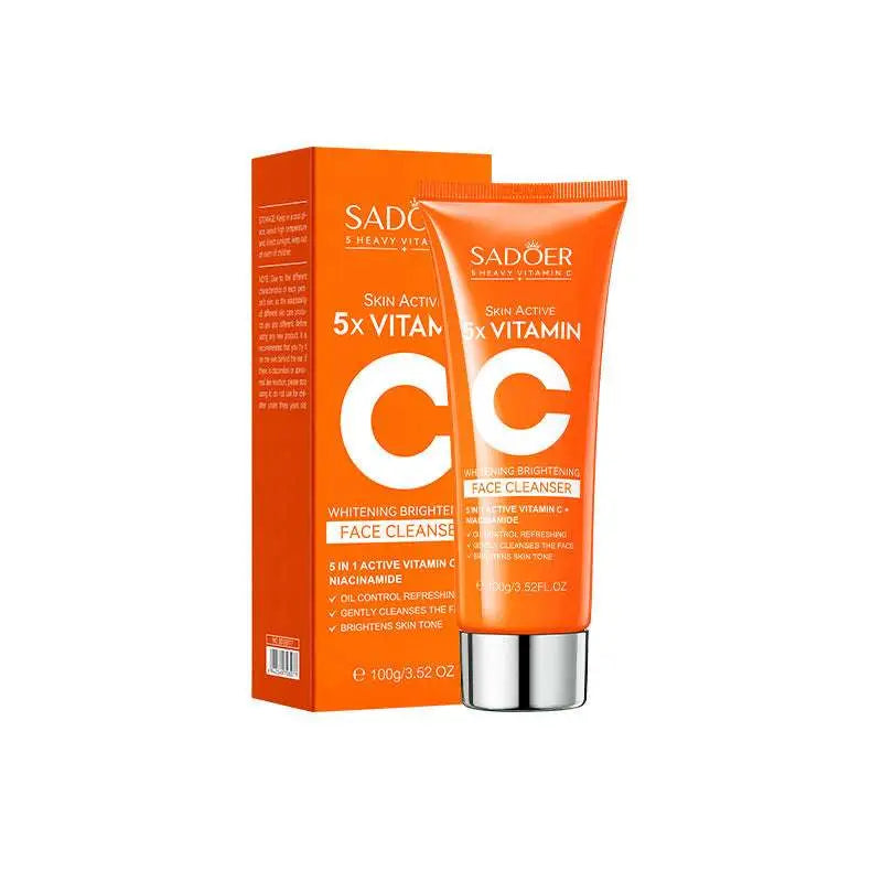 Orange tube of sadoer skin active 5x vitamin c whitening face cleanser with silver cap and matching orange rectangular box in whitening skin care gift box