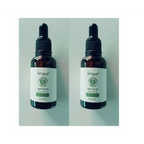 Two identical vitamin e rich hair care essential oil bottles with dark amber glass and black dropper caps by lansiyi