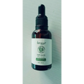 A dark amber glass bottle of lansiyi vitamin e rich hair care essential oil with a black dropper cap for hair salon use