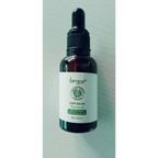 A dark amber glass bottle of lansiyi vitamin e rich hair care essential oil with a black dropper cap for hair salon use