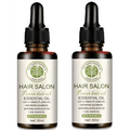 Two amber glass bottles of vitamin e rich hair care essential oil with black dropper cap for salon hair protection