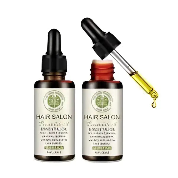 Two amber glass bottles of vitamin e rich hair care essential oil labeled hair salon with black dropper cap and red cap