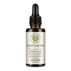 A dark amber glass bottle with black dropper cap containing vitamin e rich hair care essential oil for hair protection