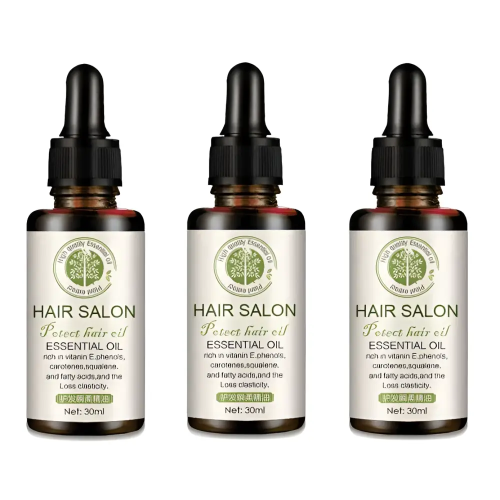 Three amber glass bottles of vitamin e rich hair care essential oil with black dropper cap and silver label with green text