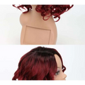 Voluminous burgundy curly european beauty wig with vibrant curly red hair and dark root-to-tip ombre effect made of high temperature wire