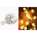Warm yellow sunshine pearl lights featuring white spherical led pearls on silver wire with battery pack