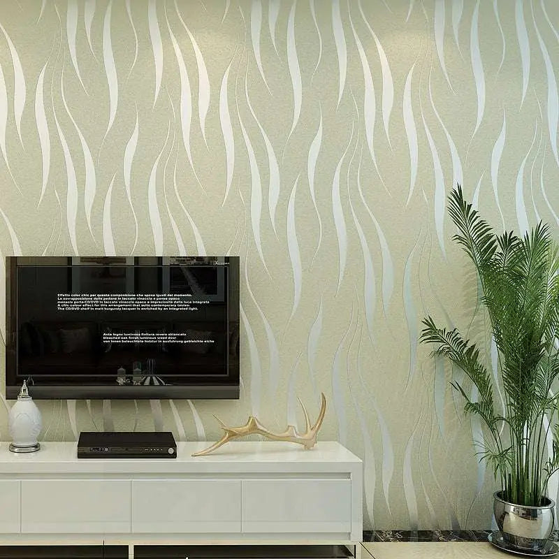 A sleek black flat-screen television mounted on a wall with beige and white woven wallpaper in women’s fashion interiors