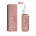 A sleek rose-gold glass bottle with white dropper cap featuring a black sunburst logo for watermelon tanning face serum skin repair drops