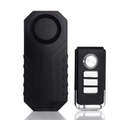 Black plastic waterproof bike alarm remote control anti theft system with rugged textured body and three silver buttons