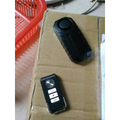 Black plastic waterproof bike alarm remote control anti theft system with textured grip and three function buttons