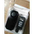 Black plastic waterproof bike alarm with circular speaker and remote control anti theft system silver buttons