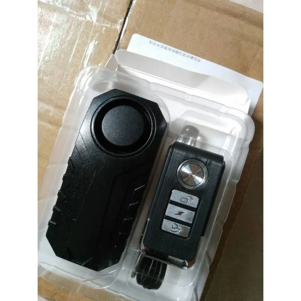 Black plastic waterproof bike alarm with circular speaker and remote control anti theft system silver buttons