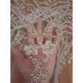 Wave style sequin bead lace fabric in sheer white with intricate silver sequin and pearl floral embroidery for wedding dress