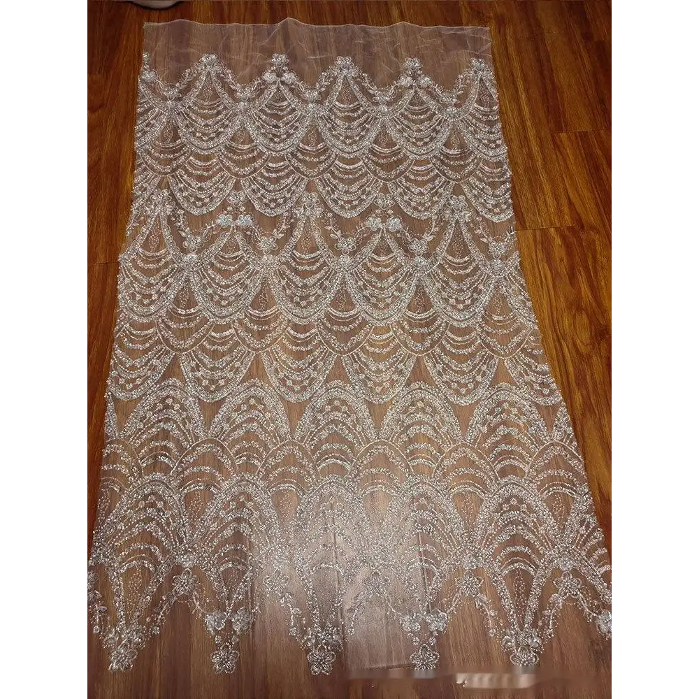 Wave style sequin bead lace fabric featuring intricate silver beaded scalloped patterns for wedding dress design