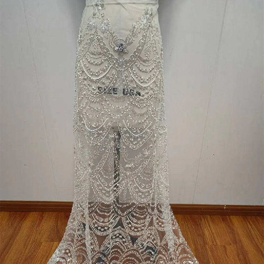 Sheer white lace wedding dress skirt with intricate silver wave style sequin bead lace and pearl embellishments