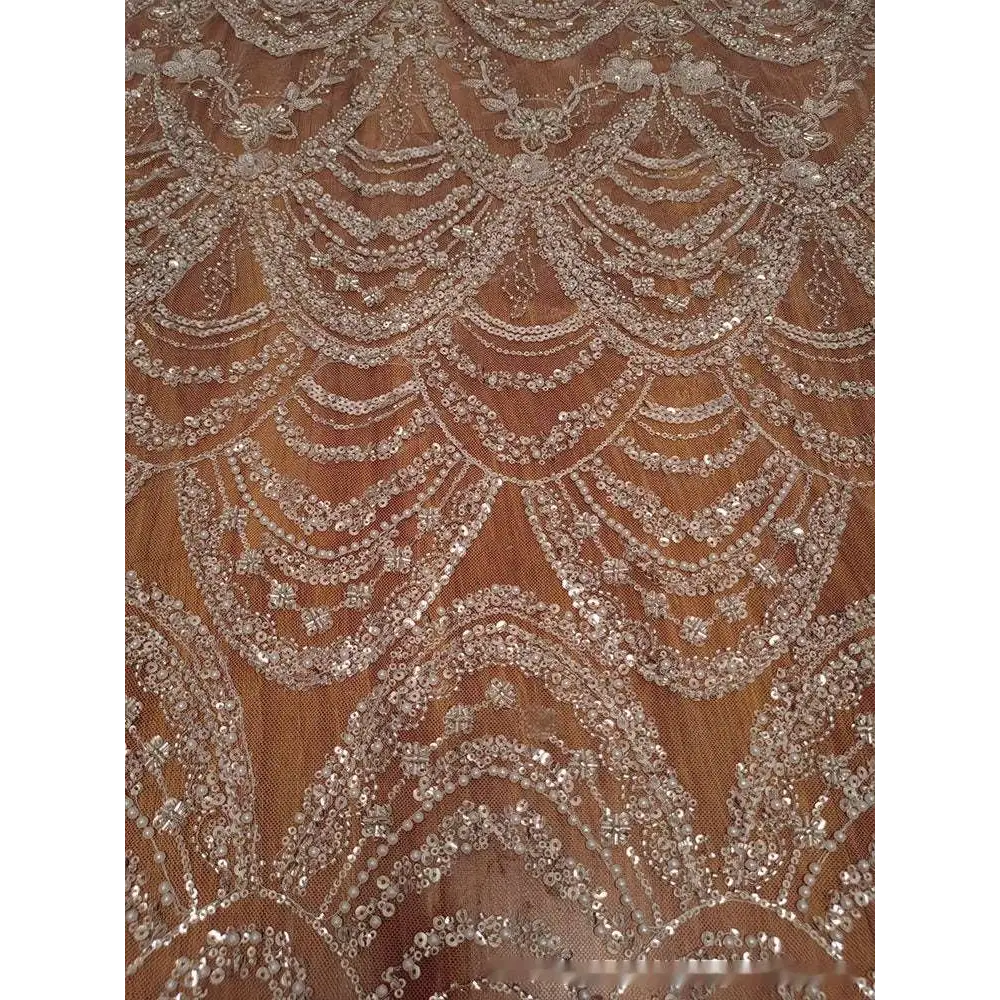 Sheer champagne wave style sequin bead lace fabric with intricate silver scalloped patterns for wedding dress