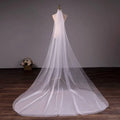 Wedding bride double-layer trimming veil in white tulle with a delicate sheer texture and long flowing train