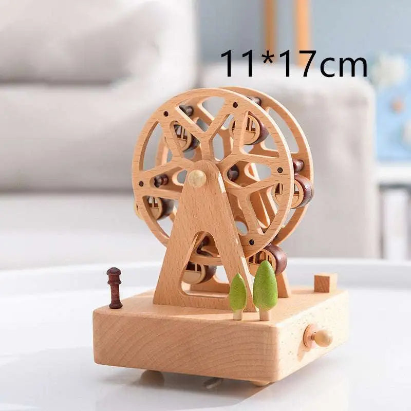 A light wood-colored wooden rotating music ferris wheel toy with green tree figurines as a wedding rocking horse table decoration